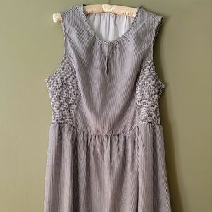 An Old Navy white sleeveless dress with grey blue strips.